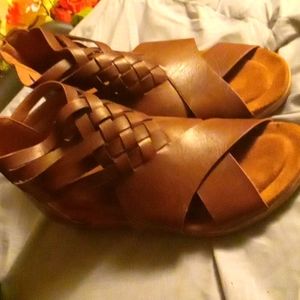 a pair of NWOT Pierre Dumas sandals in brown size 10 new never worn condition